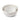 Three cream stoneware mixing bowls nested within each other with embossed sides and smooth interiors, and a spoon rest in the edge, shown on a clean white background.