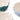Close up of the top edge of three stoneware mixing bowls showing the spoon rest detail. The bowls have embossed sides and smooth interiors, shown on a clean white background. The bowls are in teal, pale pink, and light blue, with cream-colored interiors.