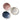 A group of 3 small beige dip bowls photographed from above on a white background. Each has a different colour interior, blue, pink and white.