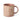 A stoneware mug in a dusty blush pink colour, decorated with a cream wax resist leaf pattern, photographed on a clean white background.