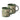 Two stoneware mugs in a deep green colour, decorated with a cream wax resist leaf pattern, photographed on a clean white background.