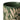 A closeup of the top edge of a stoneware mug in a deep green colour, decorated with a cream wax resist leaf pattern, photographed on a clean white background.