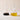 Two clear glass oil & vinegar pourers with curved spouts, one conical with balsamic vinegar inside and one rounded bulb-shaped body with olive oil, shown on a beige background.