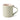 A classic ceramic mug with a sage green exterior and a soft cream interior with a curved handle. Photographed on a clean white background.